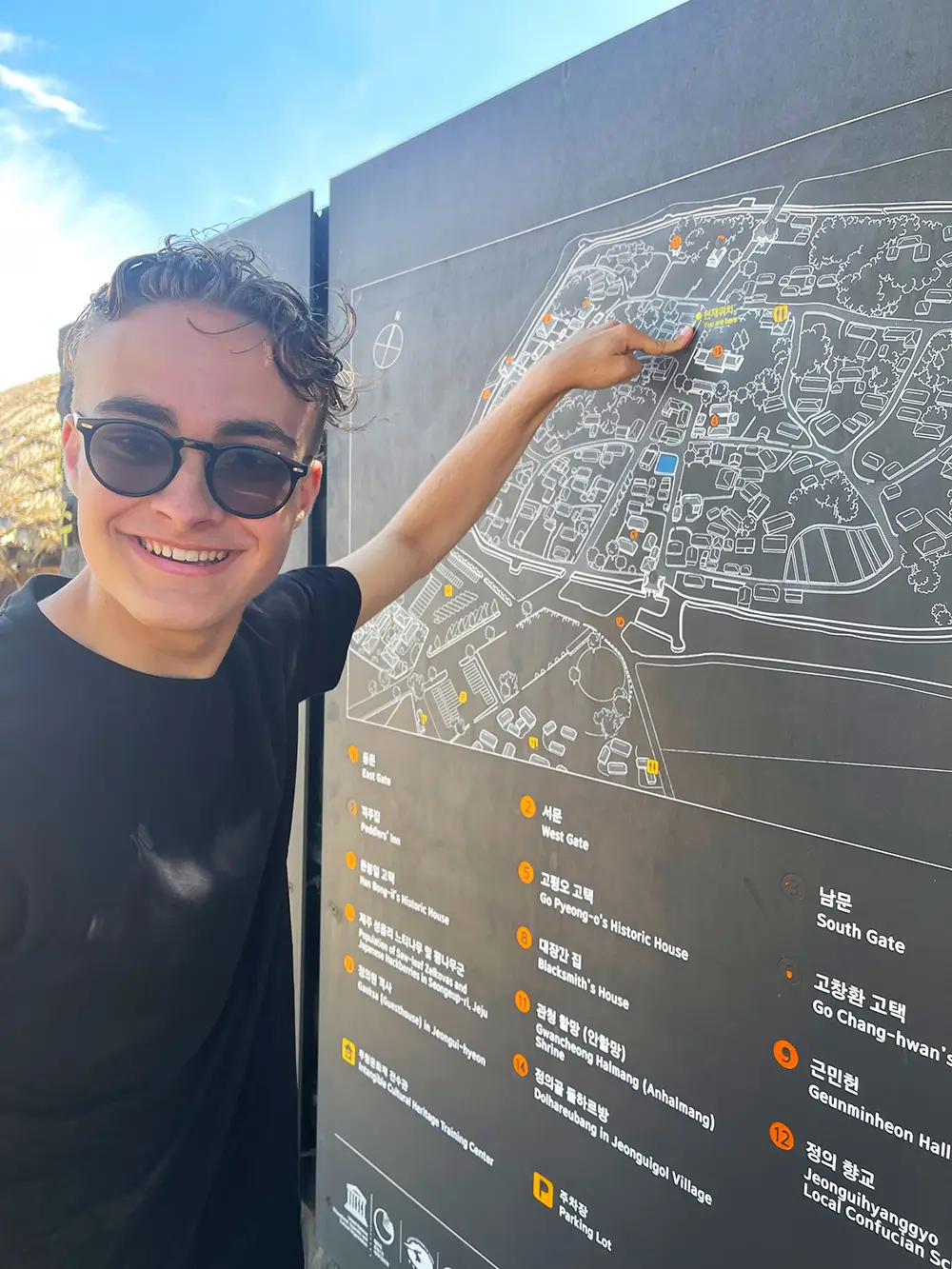 Miles pointing to map in Jeju
